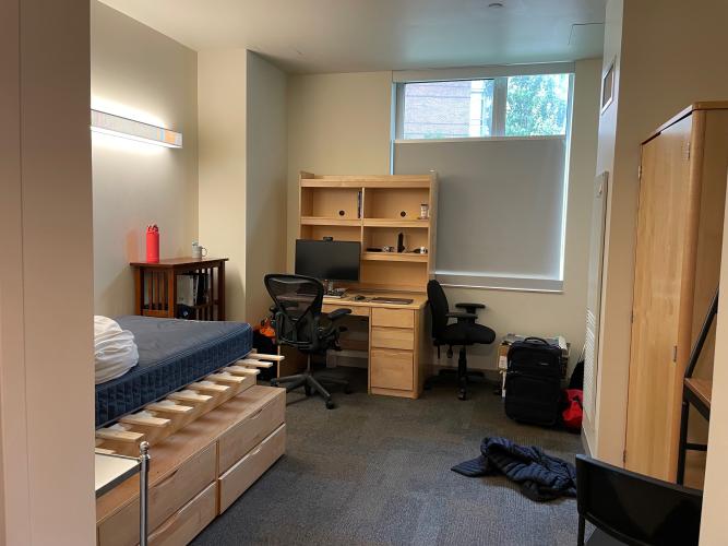 Bedroom (larger mattress + bed extender included). IKEA table off to right