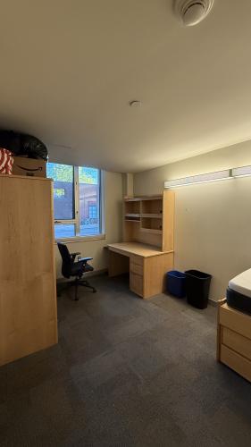 Room with table, office chair, closet