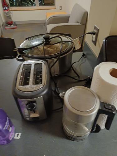 Assorted kitchen appliances, including kettle and toaster
