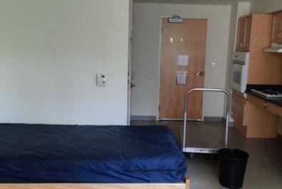 The room is fully furnished (monitor, desk, chairs, bed, etc).